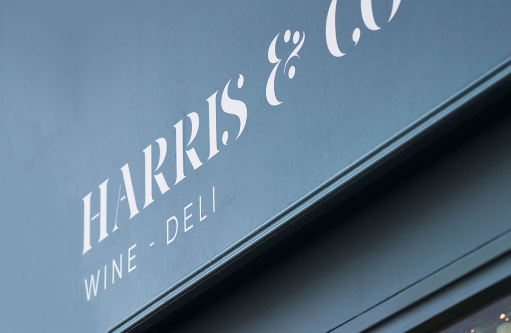 Close up of the Harris & Co Wine - Deli shopfront sign.
