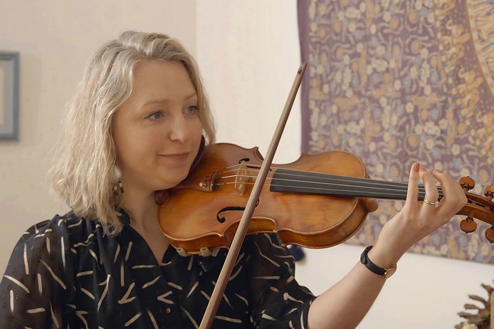 A woman playing a violin