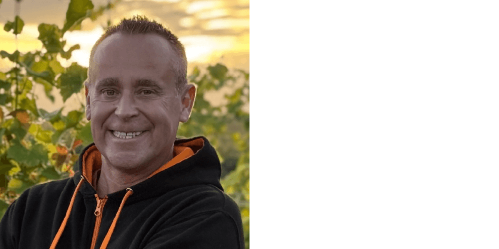 Head and shoulders photo of Stuart Wistance, Director of ProvisionIT technology consultants, with sunset and trees behind him.