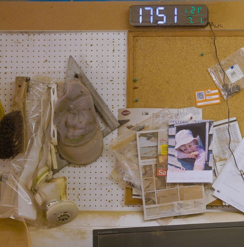 Nathan's notice board in his workshop, including a photo of his daughter.