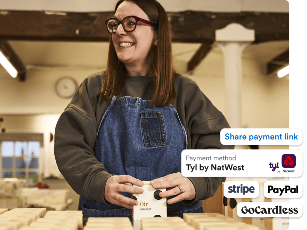 Photo of Jolene Roberts from Òir packaging their soaps.