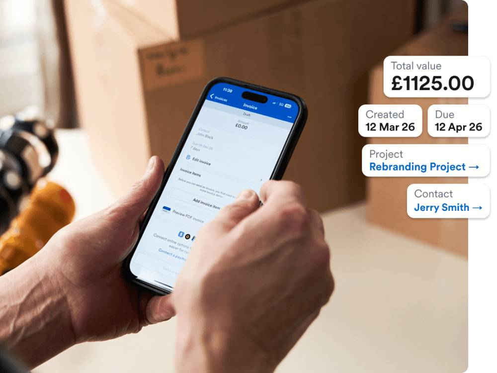 Photo of Zoë Miller from All About The Move creating an invoice on her phone using FreeAgent.