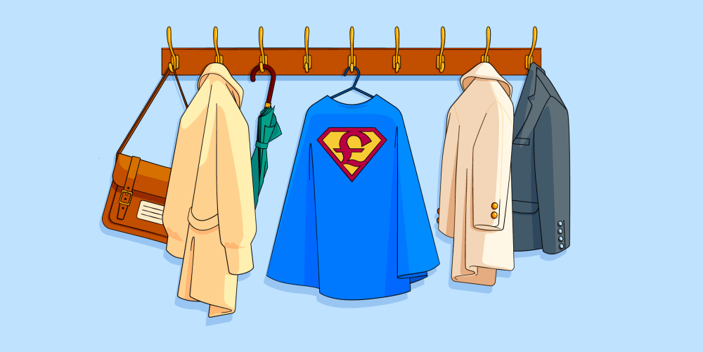 Blue superhero cape with a pound emblem hanging on a coat rack amongst coats, jackets and umbrellas.