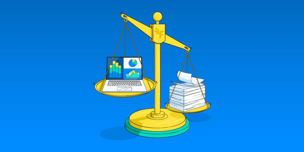 Scales balancing a laptop and papers