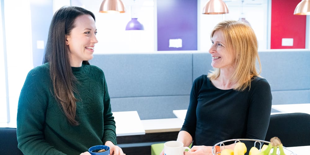 Two women from engineering talking over a cup of tea