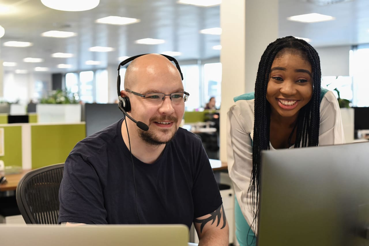 Photograph of support staff dealing with a support ticket.