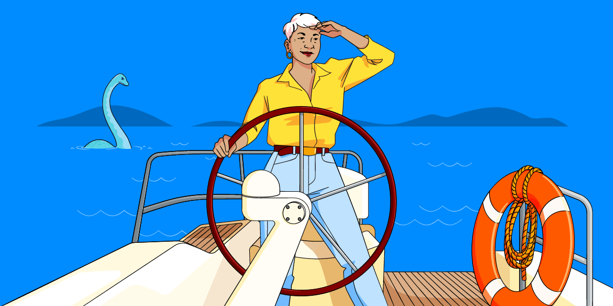 Woman standing confidently at the helm of a boat, holding the wheel and looking out to sea - Nessie, the Loch Ness monster is behind her.