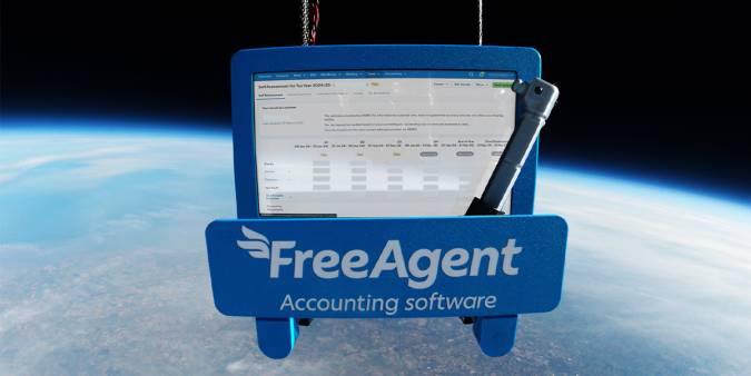 A tablet computer with FreeAgent accounting software hovering above planet Earth.