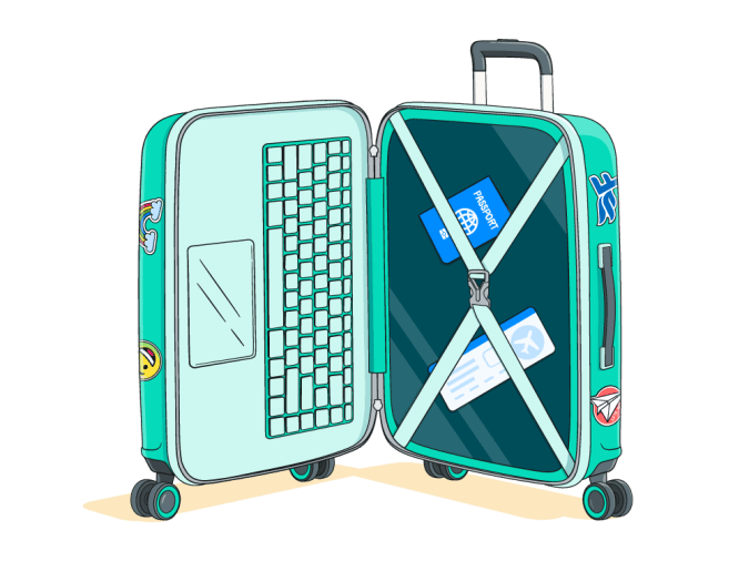 An open suitcase displaying a keyboard and tickets.
